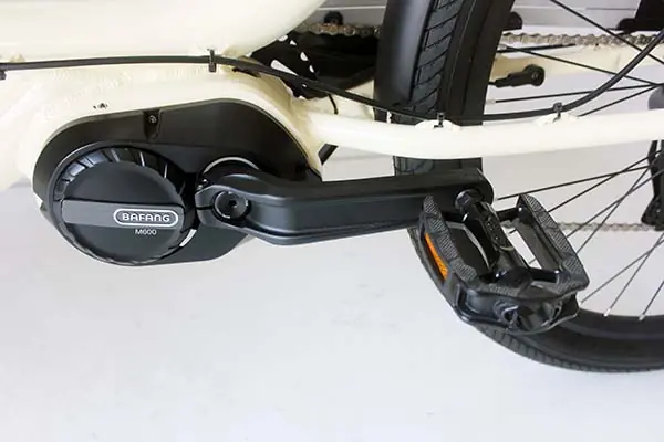 A close-up of a hub motor on a cargo e-bike wheel