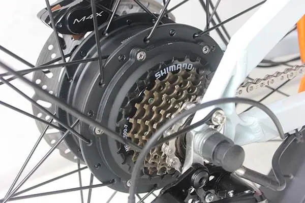 A close-up of an e-bike's cassette and derailleur.