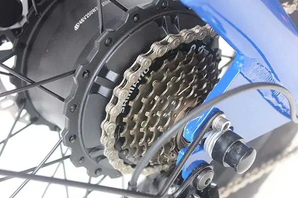 A close-up of an electric cargo bike motor mounted on the wheel hub