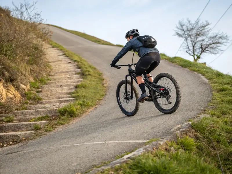 48V E-Bike Battery System A 48V e-bike battery being placed into a high-performance mountain e-bike frame.