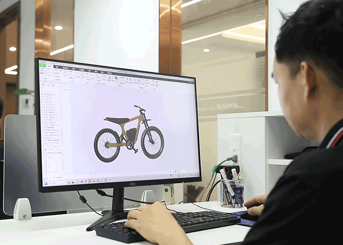 alt with keywords: engineer reviewing e-bike frame blueprints for OEM manufacturing