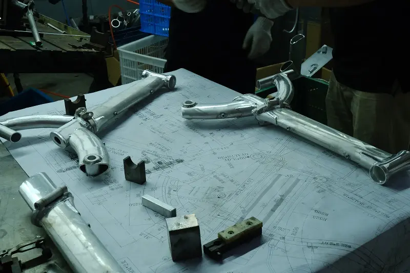 Engineers reviewing an e-bike frame blueprint