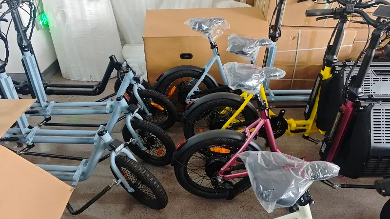 A fleet of custom cargo electric bikes ready for shipping