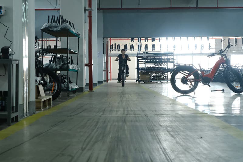 A test rider checking the brakes on an e-bike on a test track