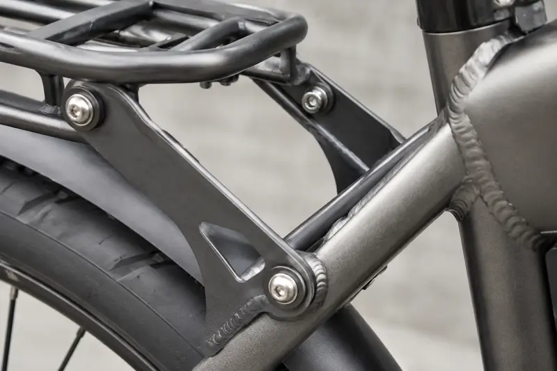 E-Bike Rack Connection Point Close-up of a reinforced connection point where a rear rack meets the e-bike frame.